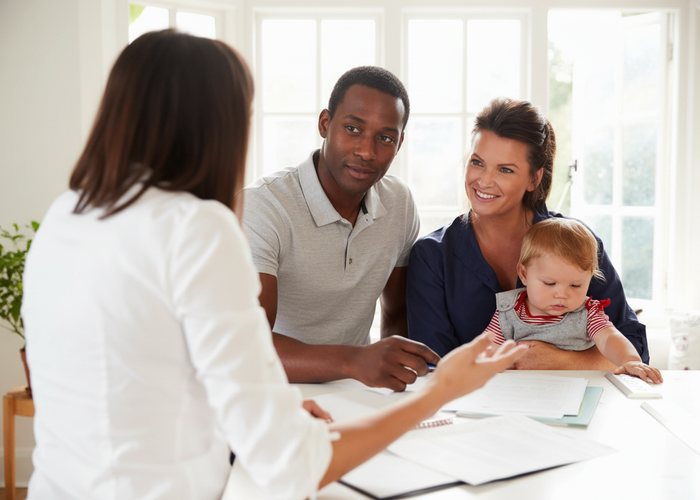 Family meeting with an insurance advisor in a warm, friendly setting